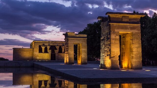Sunset over the Templo de debod day to night transition timelapse. The Temple of Debod is an ancient Egyptian temple which was rebuilt in Madrid, Spain.