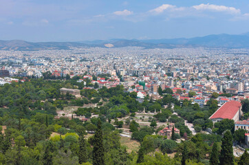 Fototapeta premium View of the Athens and the ancient Temple of Hephaestus, a doric greek temple in the north-west side of the Agora of Athens, Greece.