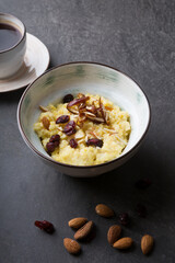 Cooked porridge served with almonds in a bowl