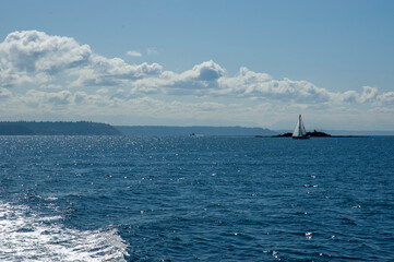 Sail boat on Puget Sound as seen from ferry