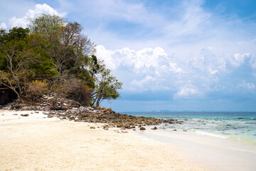 Landscape background for vacation. Beautiful tropical beach with island in Thailand. Blue sky with cloudy on sunny summer season. Seascape with island and sand. Relaxation, lifestyle concept