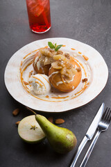 Berliner donuts served with ice cream and pears on a table