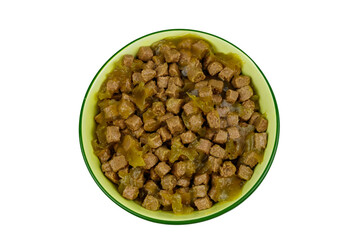 Canned food for cats or dogs in ceramic green bowl isolated on white background. Top view
