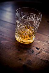 Whisky glass on a wooden surface