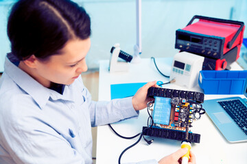 Young woman in a robotics laboratory