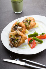 Donuts served with mashrooms and mashed potatoes