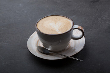 Cup of fresh cappiccino coffee with foam