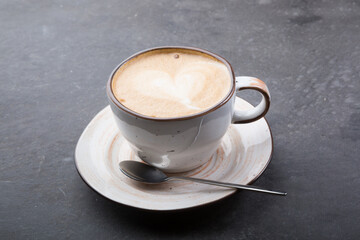 Cup of fresh cappiccino coffee with foam