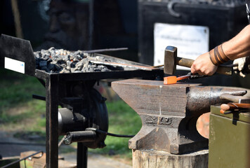 forging damascus steel by hand on the anvil 