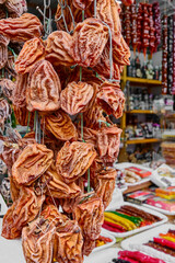 Dried persimmon from Abkhazia at the authentic bazaar of a resort town on the Black Sea coast of the Caucasus, Russia.
