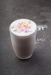 Glass cup of babyccino drink with marshmallows