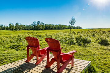 Red chairs at the buffalo loop. Elk Island National Park National Park, Alberta, Canada
