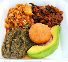 Traditional J'ouvert breakfast in Antigua: Chapup, Red Herring, Salt Fish, Johnny Cake and Avocado