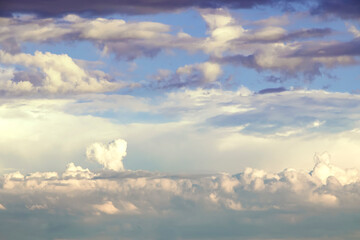 Fototapeta na wymiar White heart shaped cloud surrounded by dark clouds
