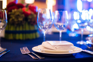 Wine glasses on a served table during a festive event