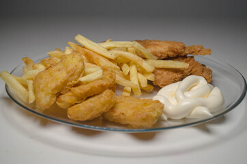fast food, breaded chicken, fries, sauce, nuggets