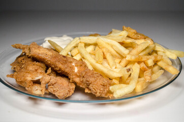 fast food, breaded chicken, fries, sauce, nuggets