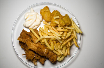 fast food, breaded chicken, fries, sauce, nuggets