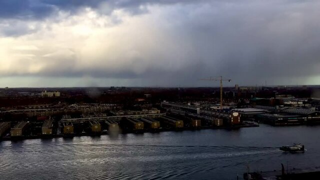 Time-lapse city, rainbow, river, and clouds