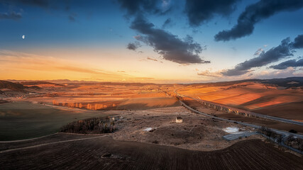Gray Chin Chapel at sunset with an interesting highway bridge in the background