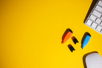 work table with yellow background copy space and hard light