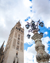 Fototapeta na wymiar La Giralda, the bell tower of Seville Cathedral on a sunny spring day, in Spain.