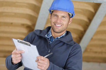 happy building inspector looking at new property
