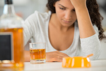 an upset woman with drinks