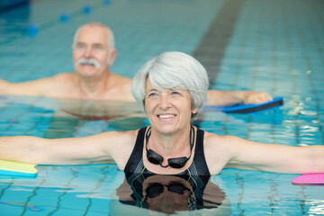 Fototapeta premium two elderly people having water exercise