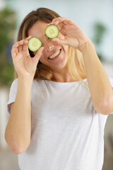 woman with cucumber on eyes