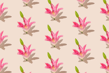 Natural blossom pattern with pink lily flowers and pale green buds on beige background. Minimal spring floral bloom concept.