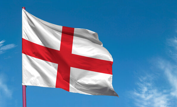 Flag of England against blue sky