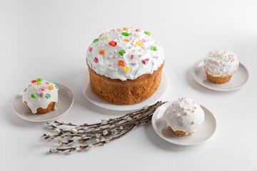 Easter cakes with willow branches on a white background