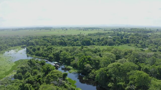 aerial image with boat drone on a river in the middle of the Pantanal Mato Grosso do Sul Brazil