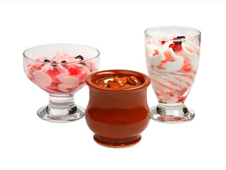 Set of ice cream of different colors and flavors with berries and nuts decoration