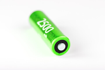 Green AA battery 2500 milliampere battery on a gray background