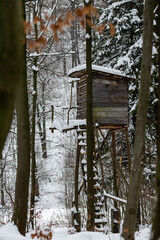 High stand for huntsmans, hunters and foresters in snowy winter forest