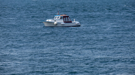 Fototapeta premium small fishing boat in the sea and fisherman, yacht,