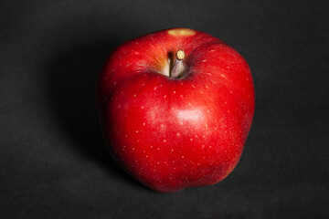 red delicious apple on black background