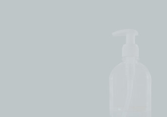 Transparent Sanitizer gel on the grey background.