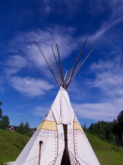 wigwam on blue sky background, North of Sweden © Tamara Sushko