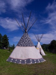 wigwam on blue sky background, North of Sweden © Tamara Sushko