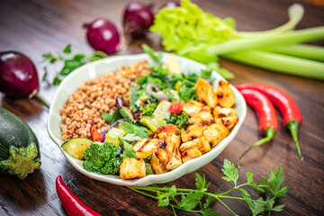 Tofu marinated in miso on fried green vegetables with ginger and chilli according to the sirt diet