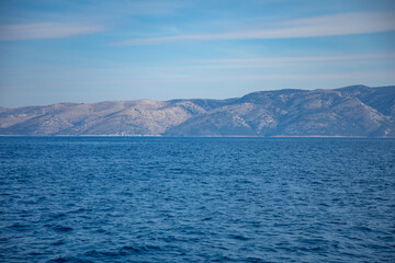 Fototapeta na wymiar View from water of rocky shore of island in Croatia