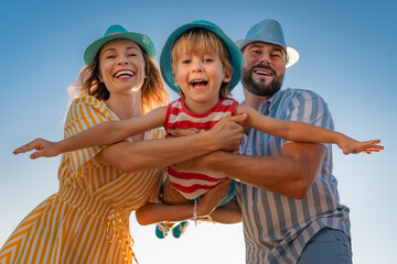 Happy family having fun on summer vacation - 427714405