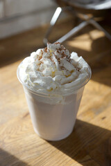 Chocolate milkshake sprinkled with cocoa