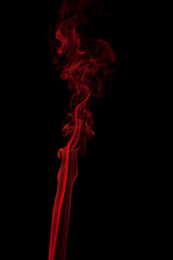 Abstract red smoke swirling on a black background.