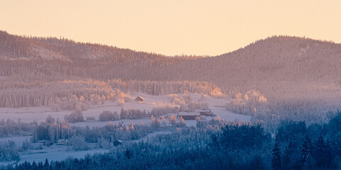 View towards Kronborgsæter, Olterudelva Valley and the Totenåsen Hills, Norway, in winter.