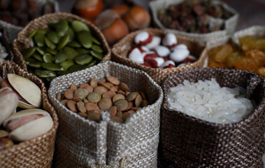 shop counter with a selection of nuts and cereals in vintage bags