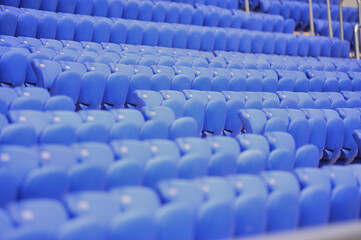 Naklejka premium The empty blue plastic seat at stadium.
